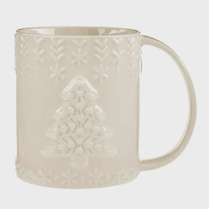 Cream-colored ceramic embossed holiday mug featuring a Christmas tree design surrounded by snowflake patterns