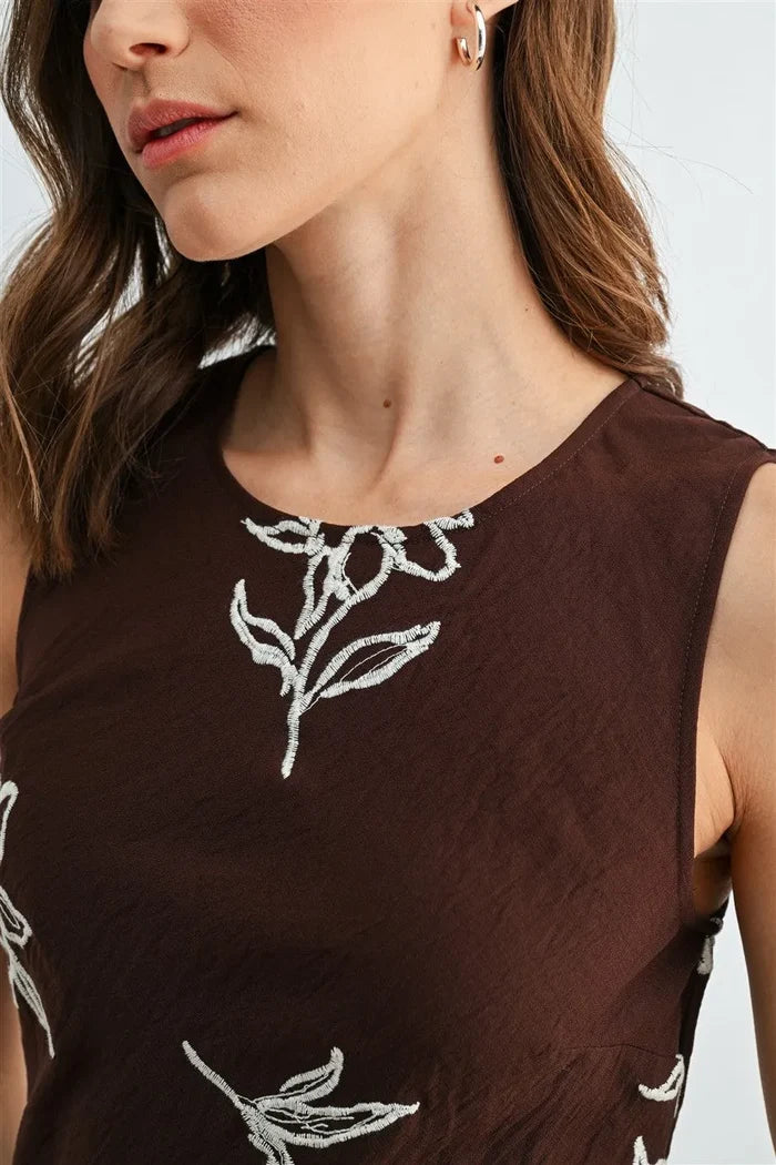 Brown embroidery sleeveless midi dress with white embroidered floral details on sleeveless midi dress fabric