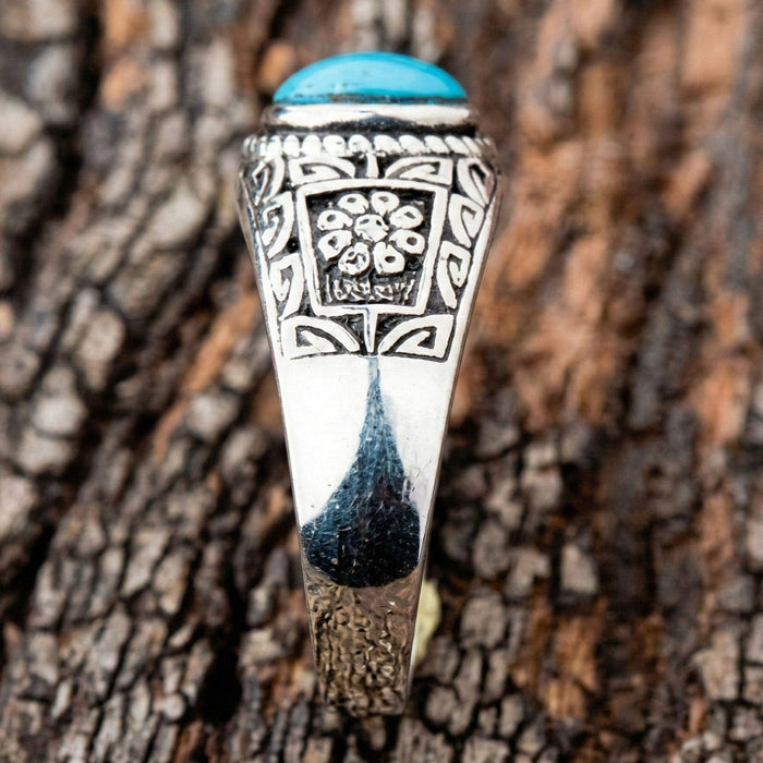 Detailed shot of the floral and geometric tribal engravings on the shank of the ring.