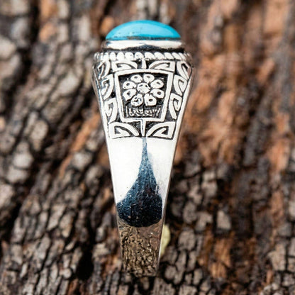 Detailed shot of the floral and geometric tribal engravings on the shank of the ring.