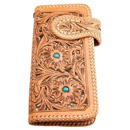 Two turquoise stones sit in the carved flowers, with a snakeskin inlay and braided lacing along the strap.