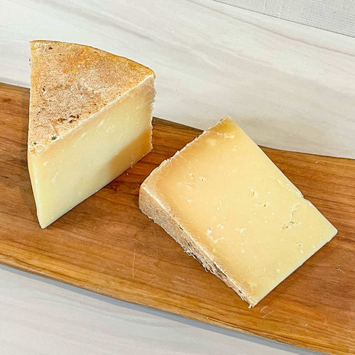 FLORY'S TRUCKLE cheese wedge from Homestead Creamery, Missouri, made with raw cow's milk, firm texture.
