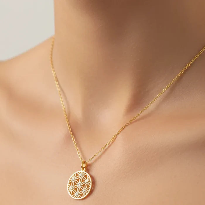Delicate gold flower coin pendant necklace with geometric pattern and stones