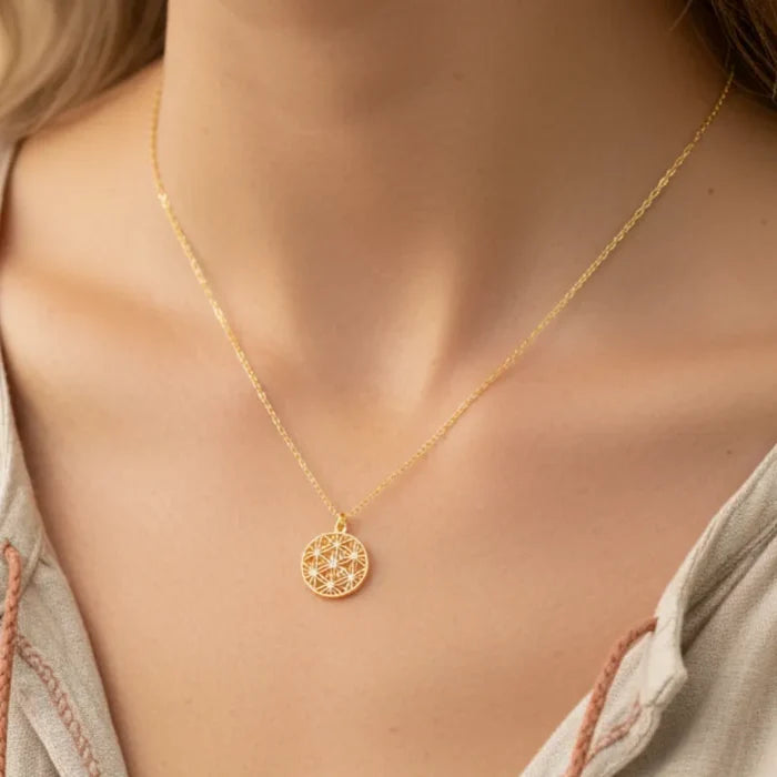 Delicate gold flower coin pendant necklace with geometric design and stones