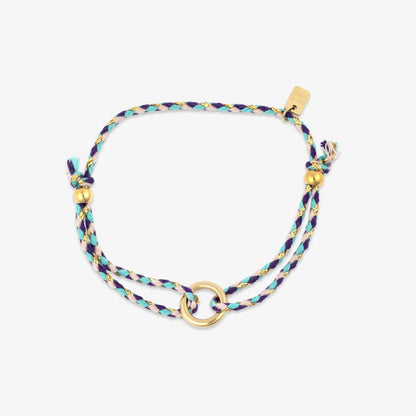 Multicolored braided bracelet with gold accents on a white background