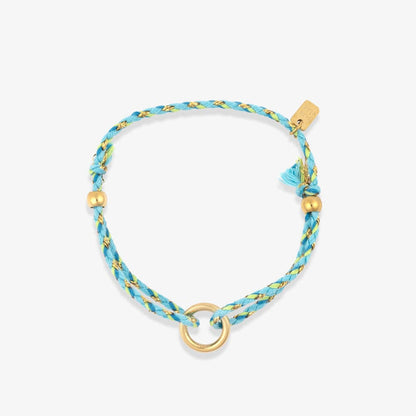 Blue braided bracelet with gold accents on a white background