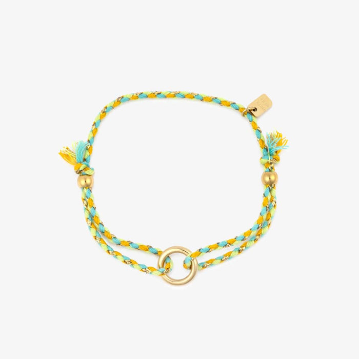 Multistrand bracelet with turquoise and yellow beads on a white background