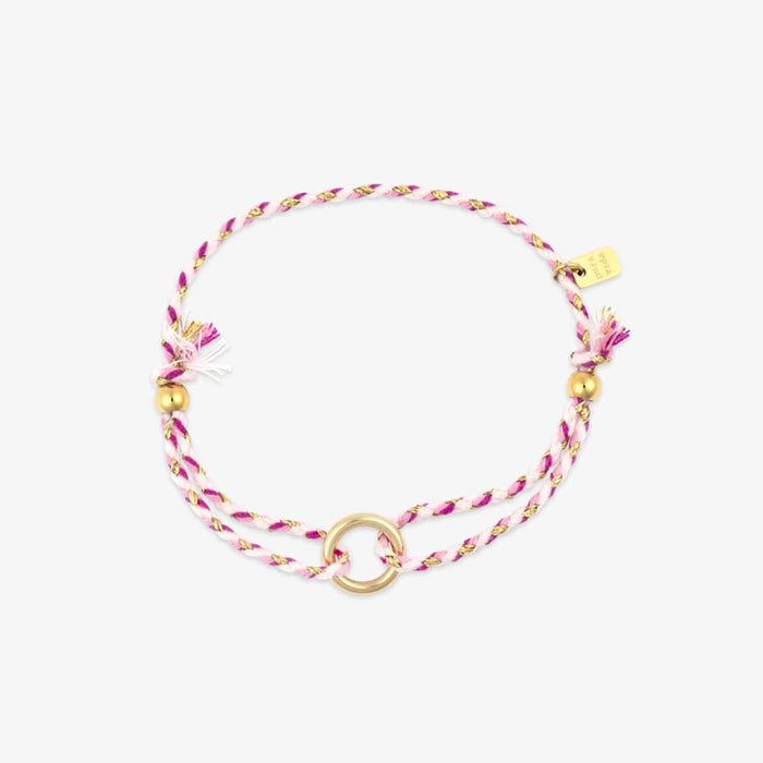 Bracelet with pink and gold beads on a white background