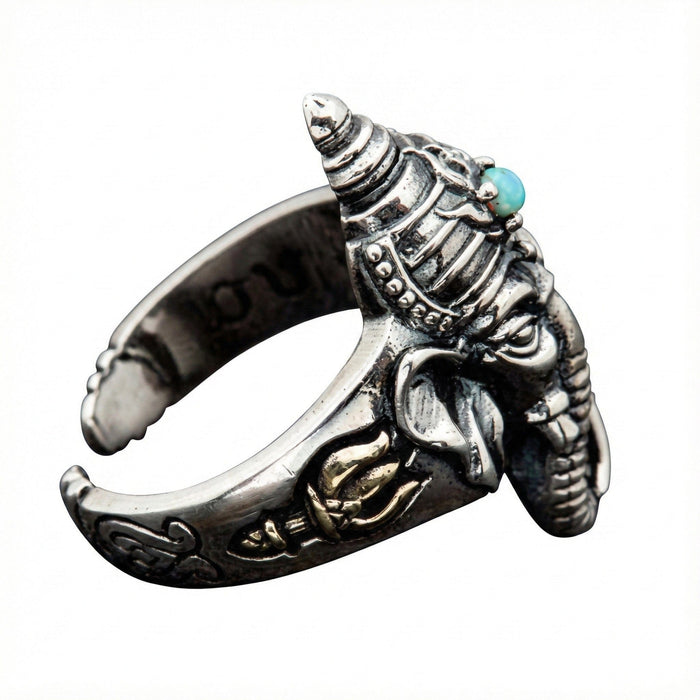 Profile view of the Lord Ganesha silver ring showing the depth of the carving and turquoise stone placement.