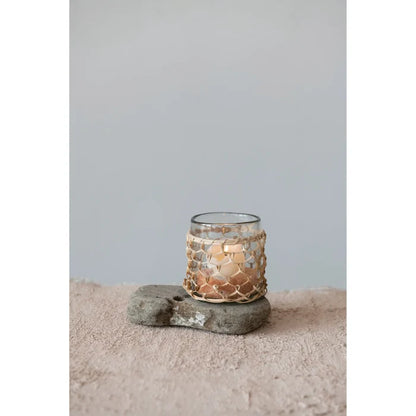 Elegant glass rattan wrapped votive holder featuring a chic gold foil design