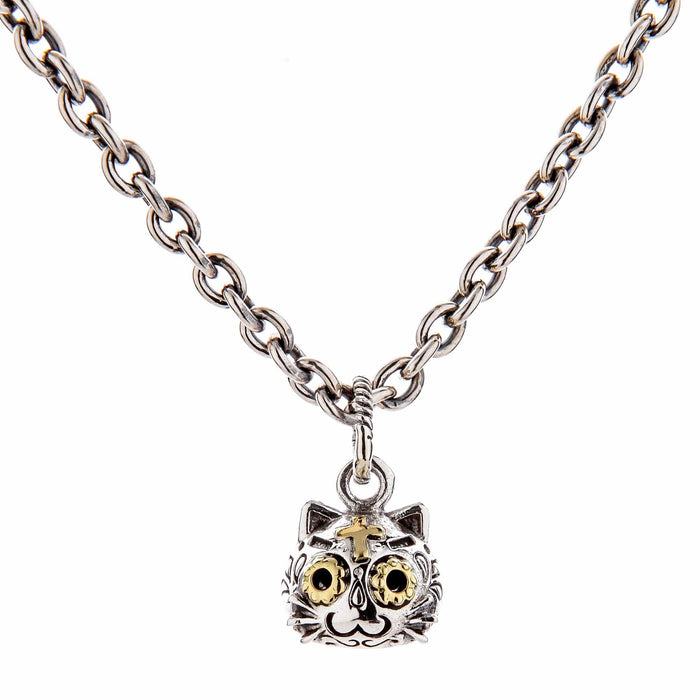 The gothic cat pendant shown hanging from a sterling silver necklace.