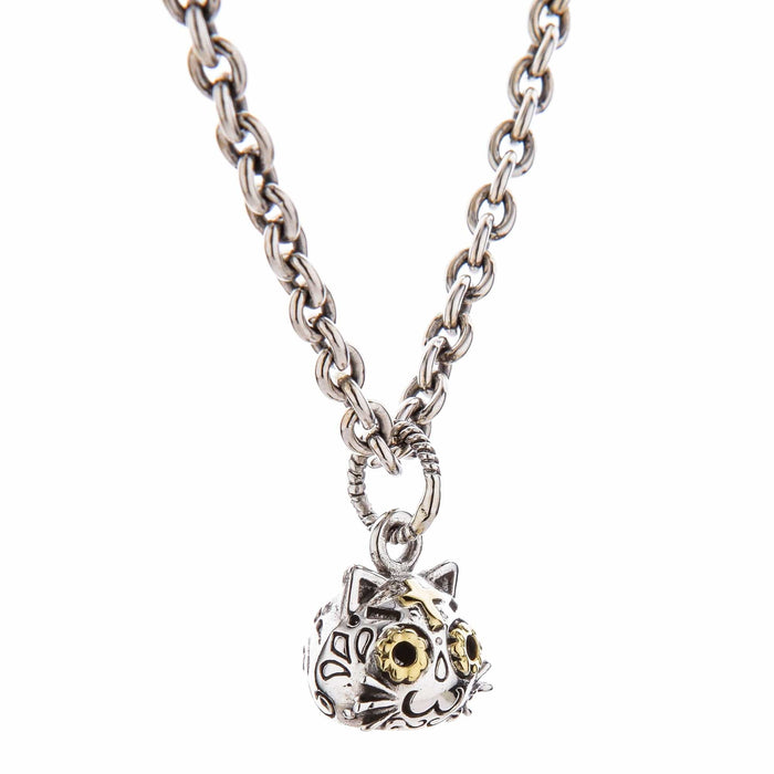 Hand-polished sterling silver unique gothic cat jewelry with golden eyes and mystical design elements.