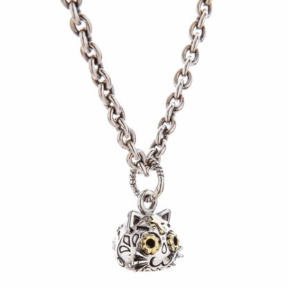 Hand-polished sterling silver unique gothic cat jewelry with golden eyes and mystical design elements.