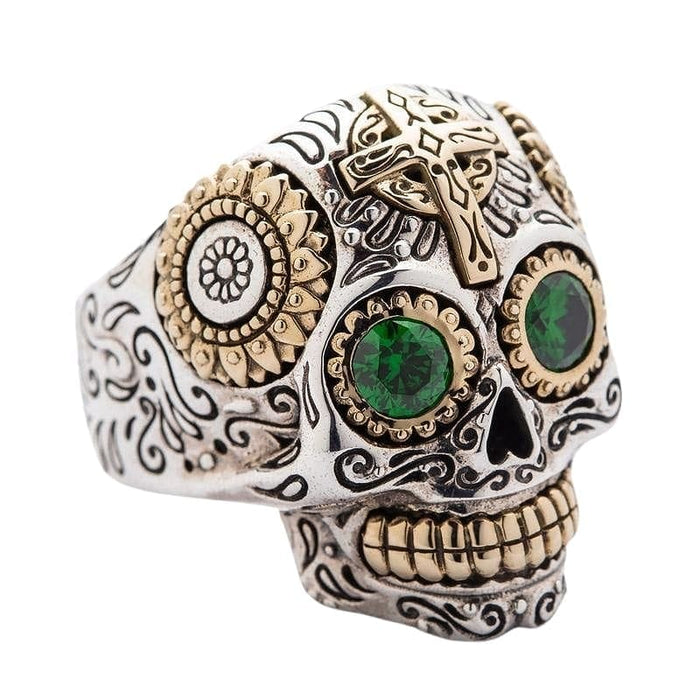 Close-up of the intricate floral patterns and cross detail on the two-tone sugar skull ring.