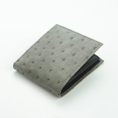 Ostrich wallet at angle showing grey quill exterior and black interior edge