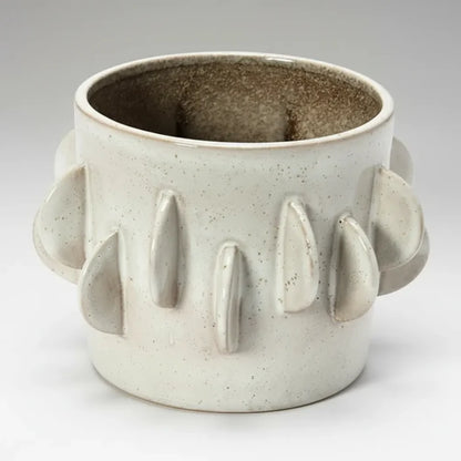 Handmade stoneware planter in antique white reactive glaze with ridges and handles