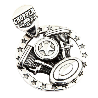 Detailed view capturing the CHOPPER skull bail, star-studded frame, and ribbed engine cylinders of the silver necklace.
