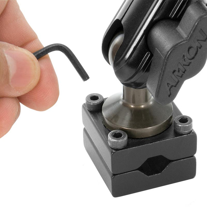 A hand holds a hex key near screws on a black ARKON bracket, part of the Heavy-Duty Headrest Mounting Pedestal with 10 Arm for securing tablet holders to a vehicle’s rear seat for entertainment purposes.