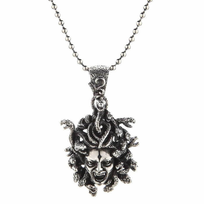Full length shot of the oxidized gorgon pendant hanging perfectly straight on a silver ball chain