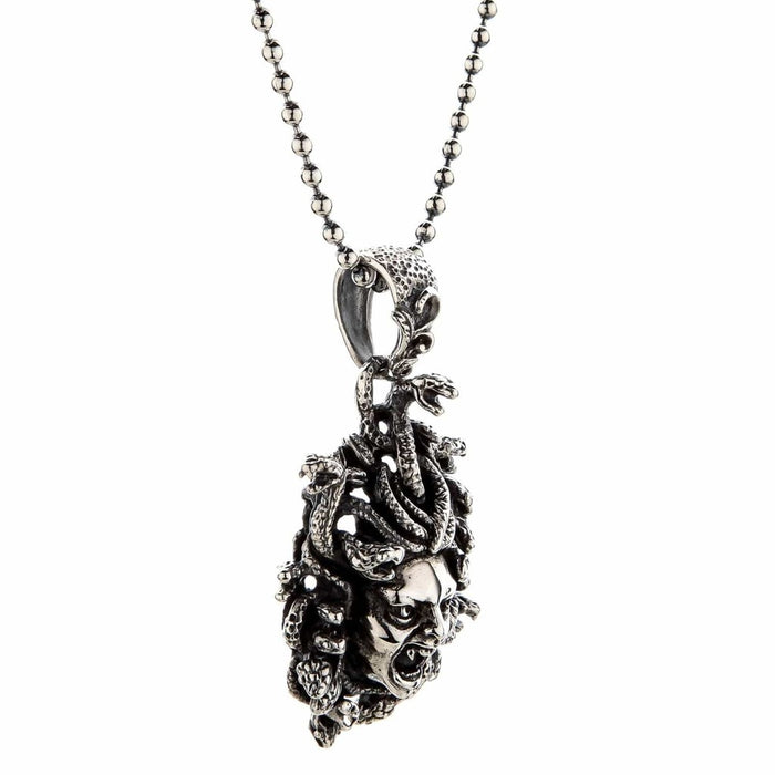 Right profile of the mythology-inspired pendant showing the thick bail and 3D sculpting