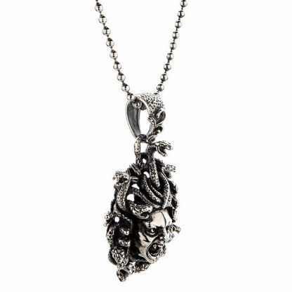 Right profile of the mythology-inspired pendant showing the thick bail and 3D sculpting