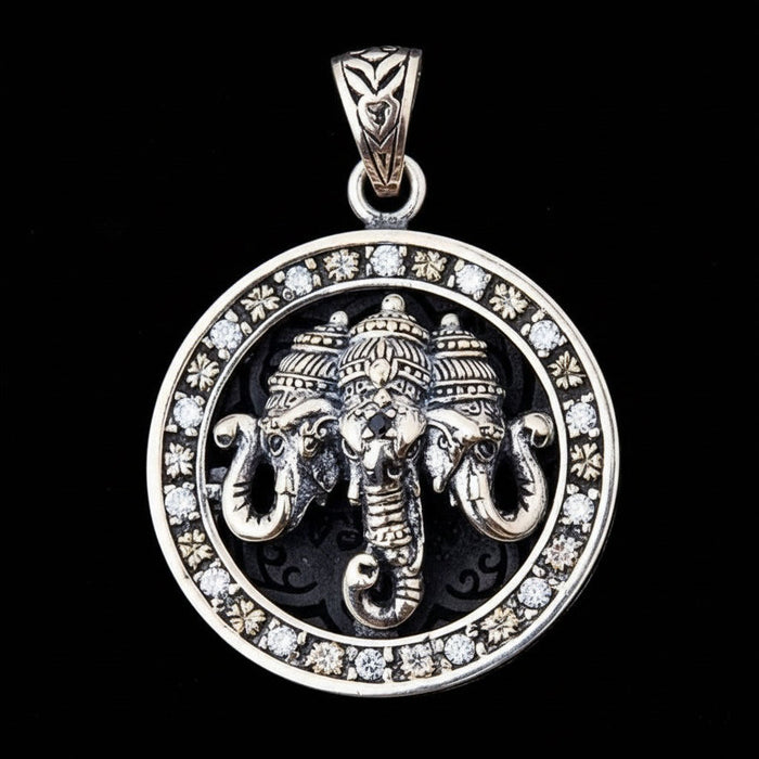 A Hindu Ganesha elephant pendant in 925 sterling silver, featuring a three-headed elephant and a clear stone halo.