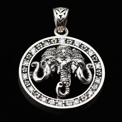 Angled view of the three-headed Airavata elephant pendant in sterling silver with clear stones on a black background.