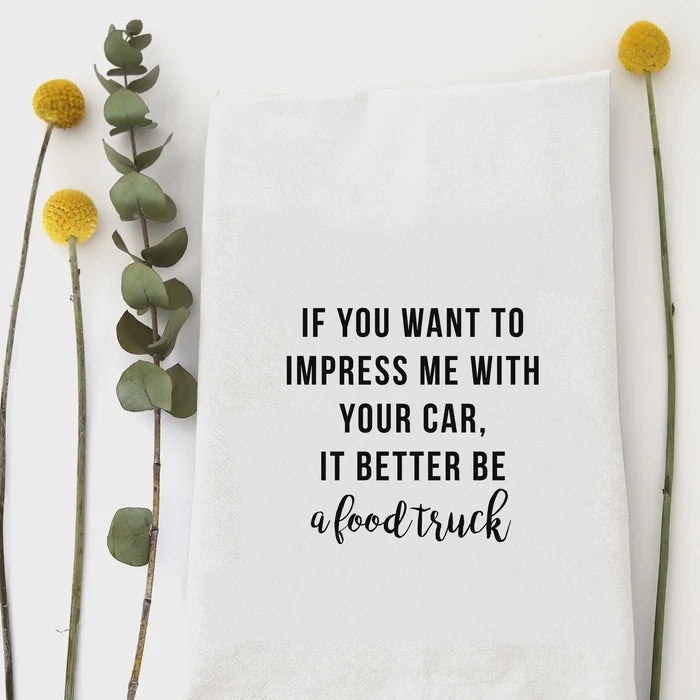 White cotton kitchen tea towel with Impress Me Food Truck quote