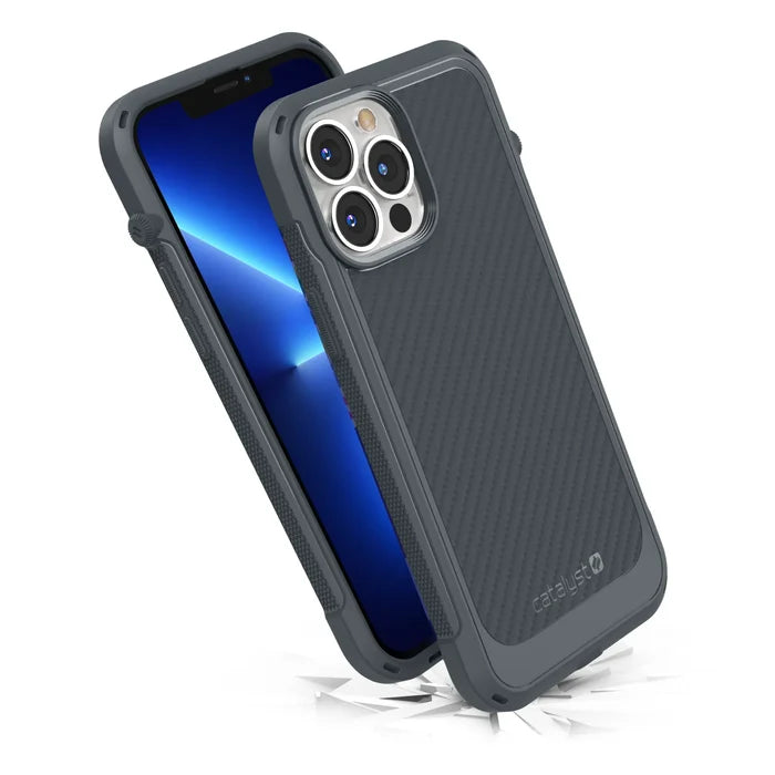 The iPhone 13 Pro Max in a Catalyst Case US Vibe Case (Battleship Gray), MagSafe compatible, is shown angled to display cracks beneath. Its rugged MIL-STD 810G design ensures drop proof protection and superior durability.