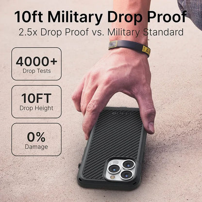 A hand sets an iPhone 13 Pro Max in a Catalyst Case US Vibe Case (MagSafe Compatible, black textured) face down on concrete. Text: "10ft Military Drop Proof, 2.5x vs. Military Standard." Infographics: "4000+ Drop Tests," "10FT," "0% Damage.