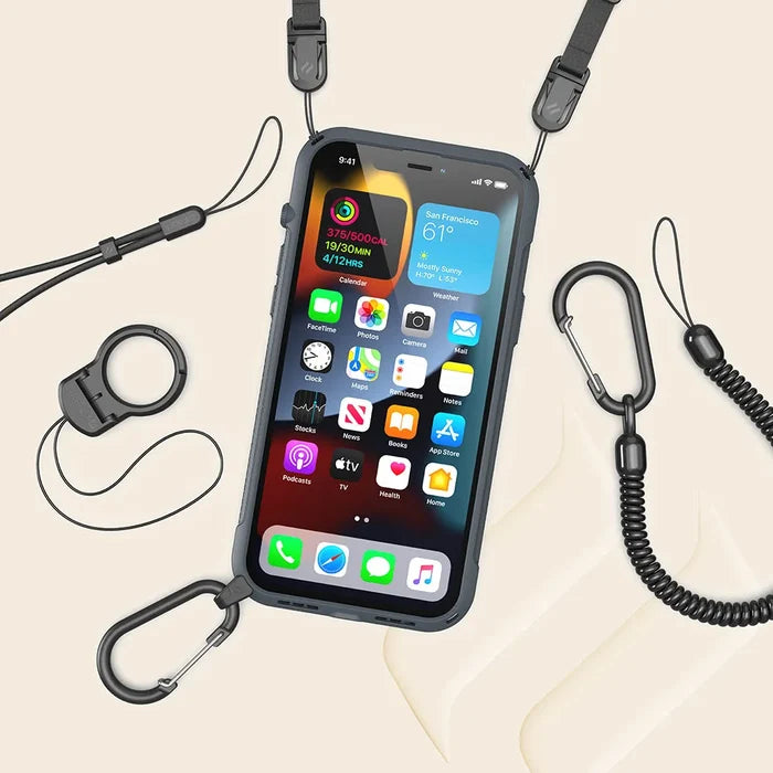The Catalyst Case US iPhone 13 Pro Max Vibe Case, MagSafe compatible, is shown in black with a screen displaying apps, attached to a lanyard with carabiner clips and adjustable straps. Coiled cords and an extra loop accessory are nearby on a beige background.
