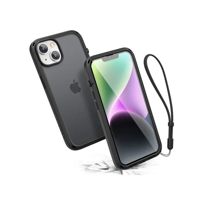 The Catalyst Case US iPhone 14 - Influence Case in Stealth Black, with a matching wrist strap, floats above a white surface displaying pastel abstract art. MIL-STD 810G drop proof, its dual cameras and screen remain undamaged among scattered shards below.
