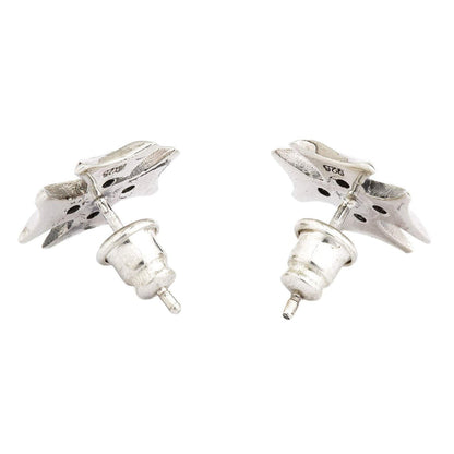 The back view of a pair of sterling silver Iron Cross stud earrings, clearly showing the 925 hallmark stamp for authenticity.