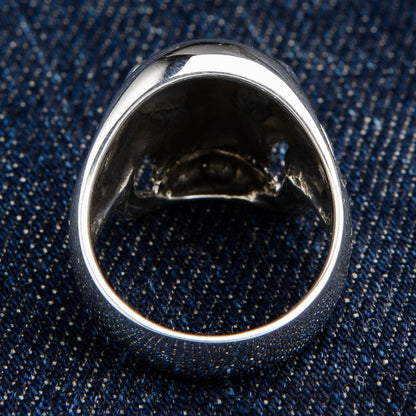 The back of the solid silver iron cross skull ring, showing the polished band.