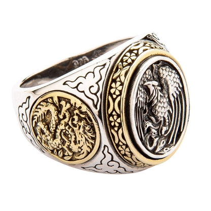 A solid sterling silver and brass signet ring symbolizing the Yin and Yang with a phoenix and dragon.