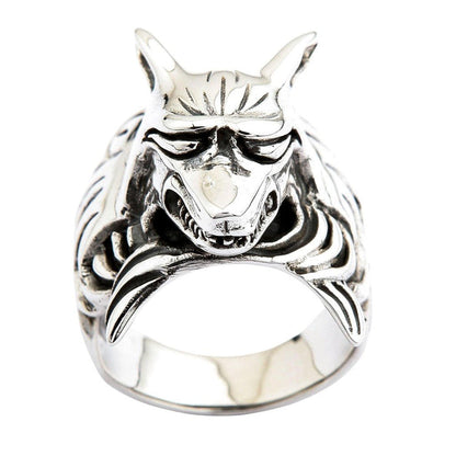 Direct front view of sterling silver kitsune yokai ring showing horned demon face with menacing grin and ornate scrollwork band
