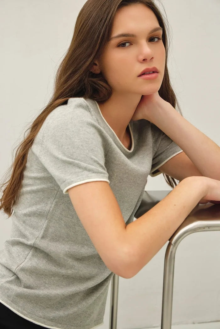 Layered look essential short sleeve sweater top in soft gray ribbed knit with white trim on neckline and sleeve cuffs