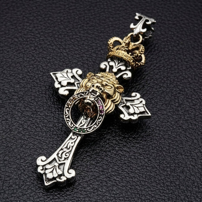 Gothic cross pendant featuring Lion of Judah with Rasta color stones in red gold and green angled view