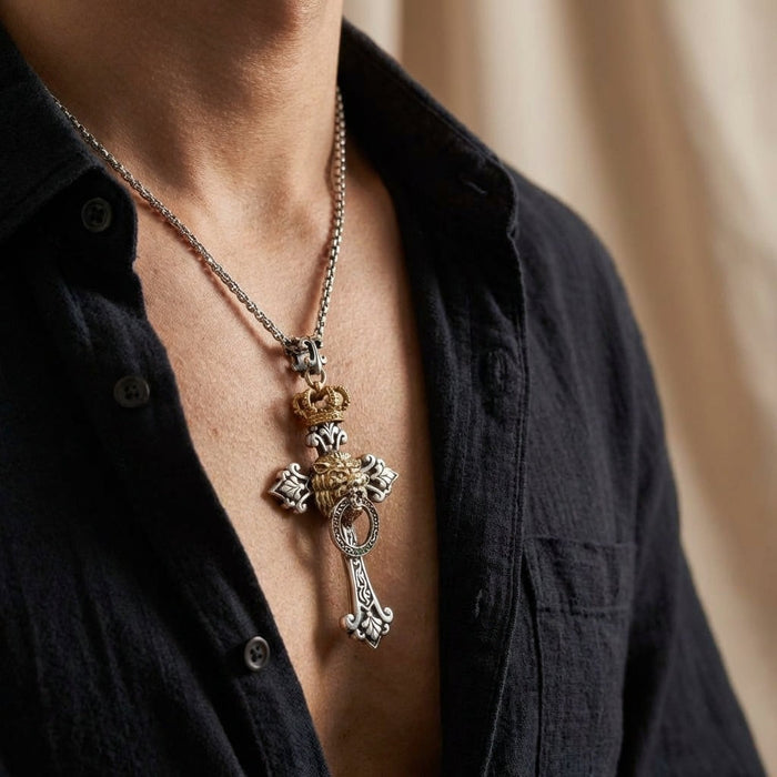 Mens Lion of Judah cross pendant worn on silver chain with dark shirt showing scale and styling