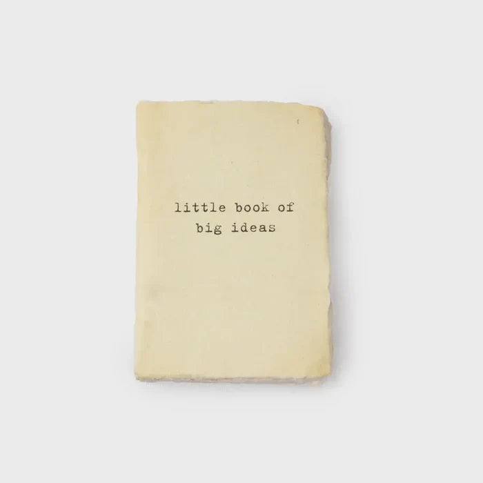 Cream-colored notebook with Little Book of Big Ideas cover design in boho style