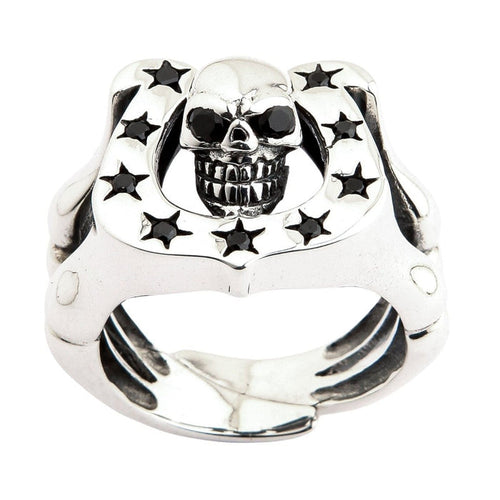 Sterling silver skull horseshoe ring with black CZ stones front view showing detailed skull face and star accents