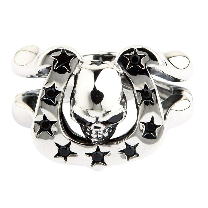 Top down view of skull horseshoe ring showing inverted skull emerging from lucky horseshoe with black gemstones