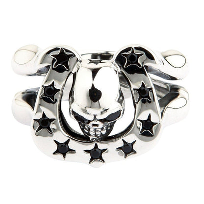 Top down view of skull horseshoe ring showing inverted skull emerging from lucky horseshoe with black gemstones