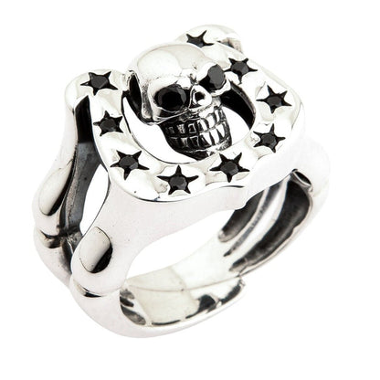 Detailed angle of biker style skull ring with horseshoe frame and star shaped black stone accents in sterling silver
