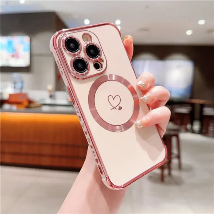 a woman holding a phone case with a heart on it