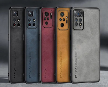 Five smartphones in different colors lined up side by side, showcasing their rear camera arrays.