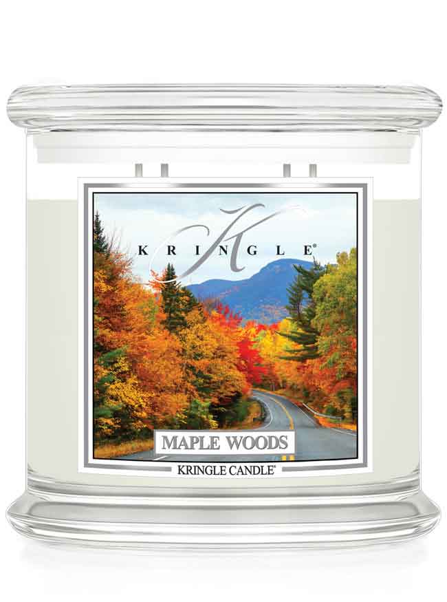 Kringle Candle Maple Woods scented 4-wick candle with a fall scene label on a white background