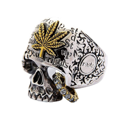 Three quarter view of cannabis leaf skull ring in sterling silver with CZ stone details
