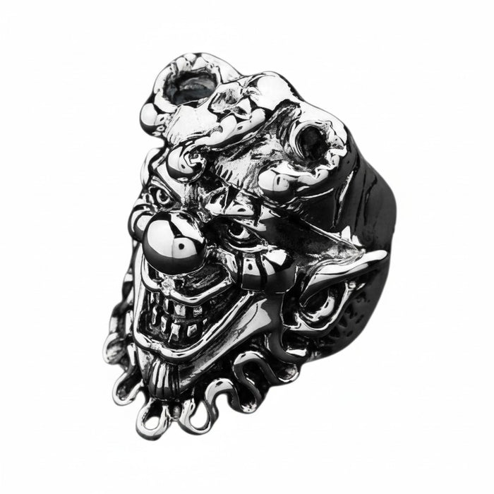 A handcrafted ring showing the detailed face of the Joker in polished and oxidized sterling silver.