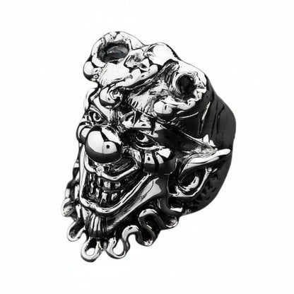 A handcrafted ring showing the detailed face of the Joker in polished and oxidized sterling silver.